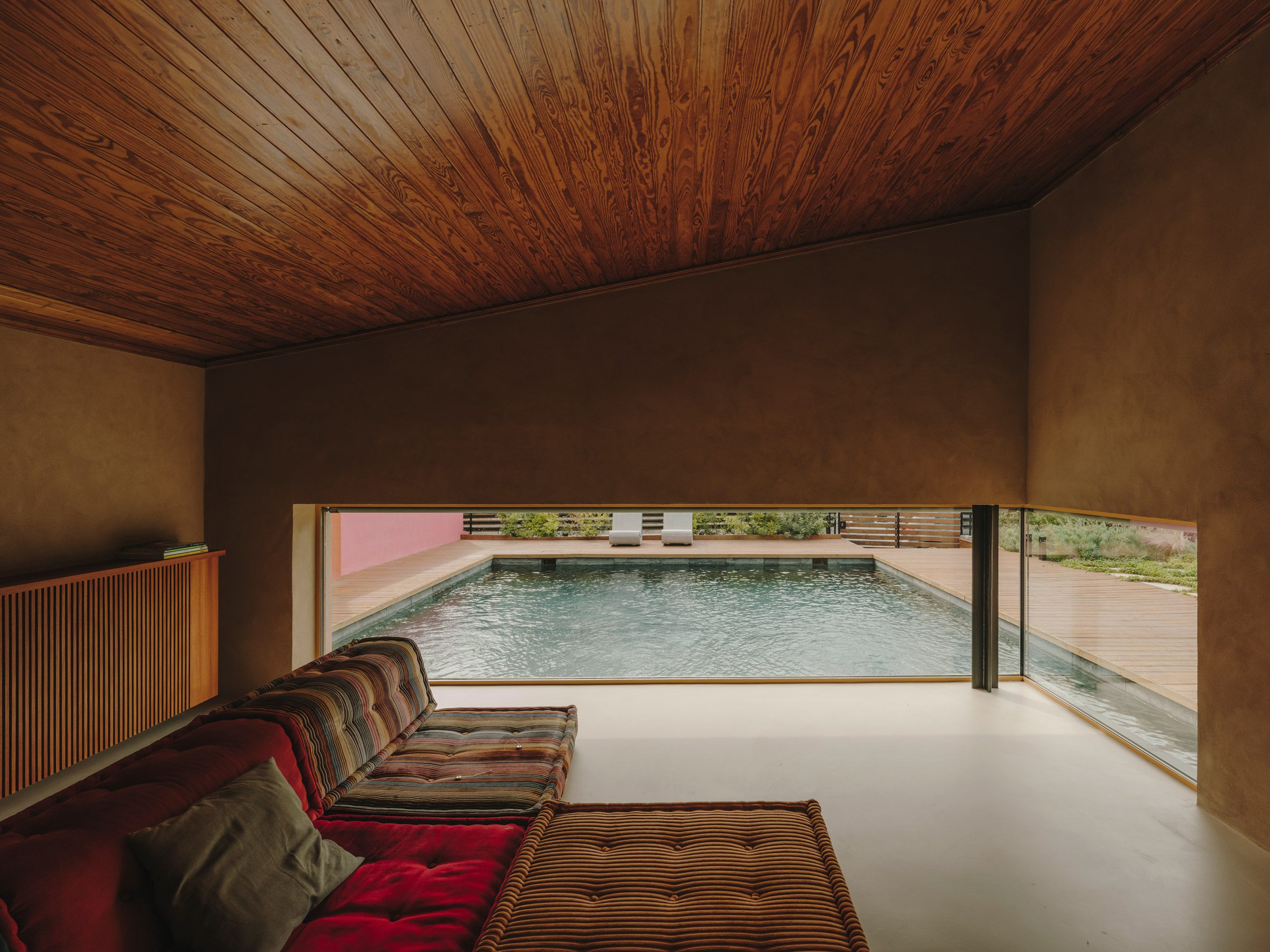 studio holzrausch infuses bold colour into tranquil mediterranean