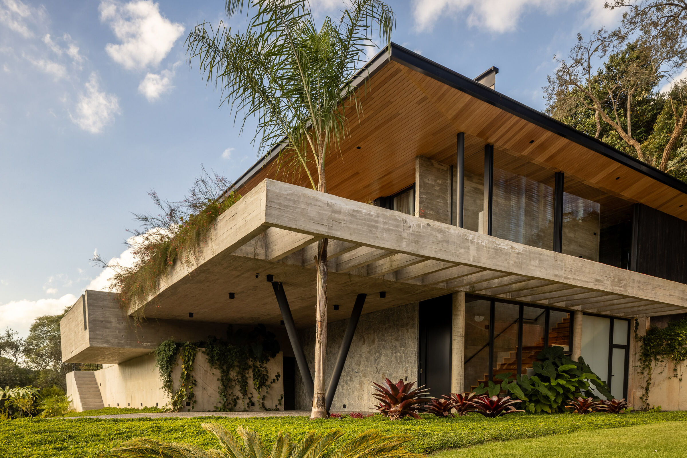 casa 258 redefines hillside living with an open-plan interior | the ...