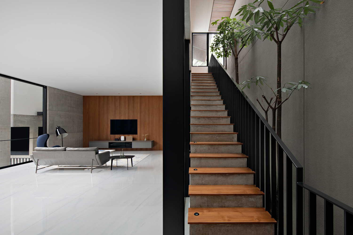 hideout house celebrates indoor-outdoor connection around a shallow ...