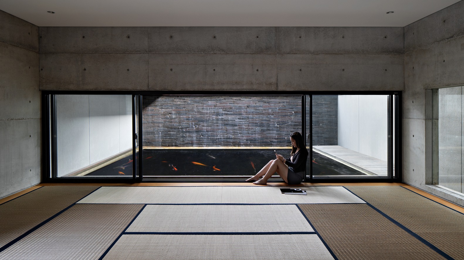 hideout house celebrates indoor-outdoor connection around a shallow ...