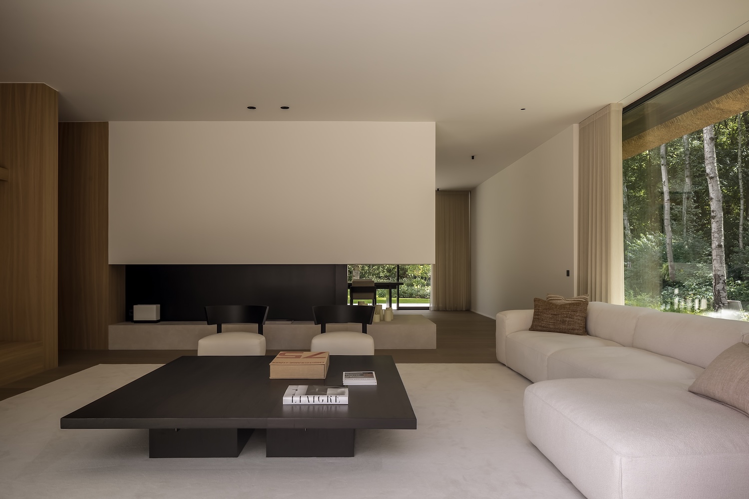 belgium forest-edge ks residence wrapped beneath a thatched gabled roof ...