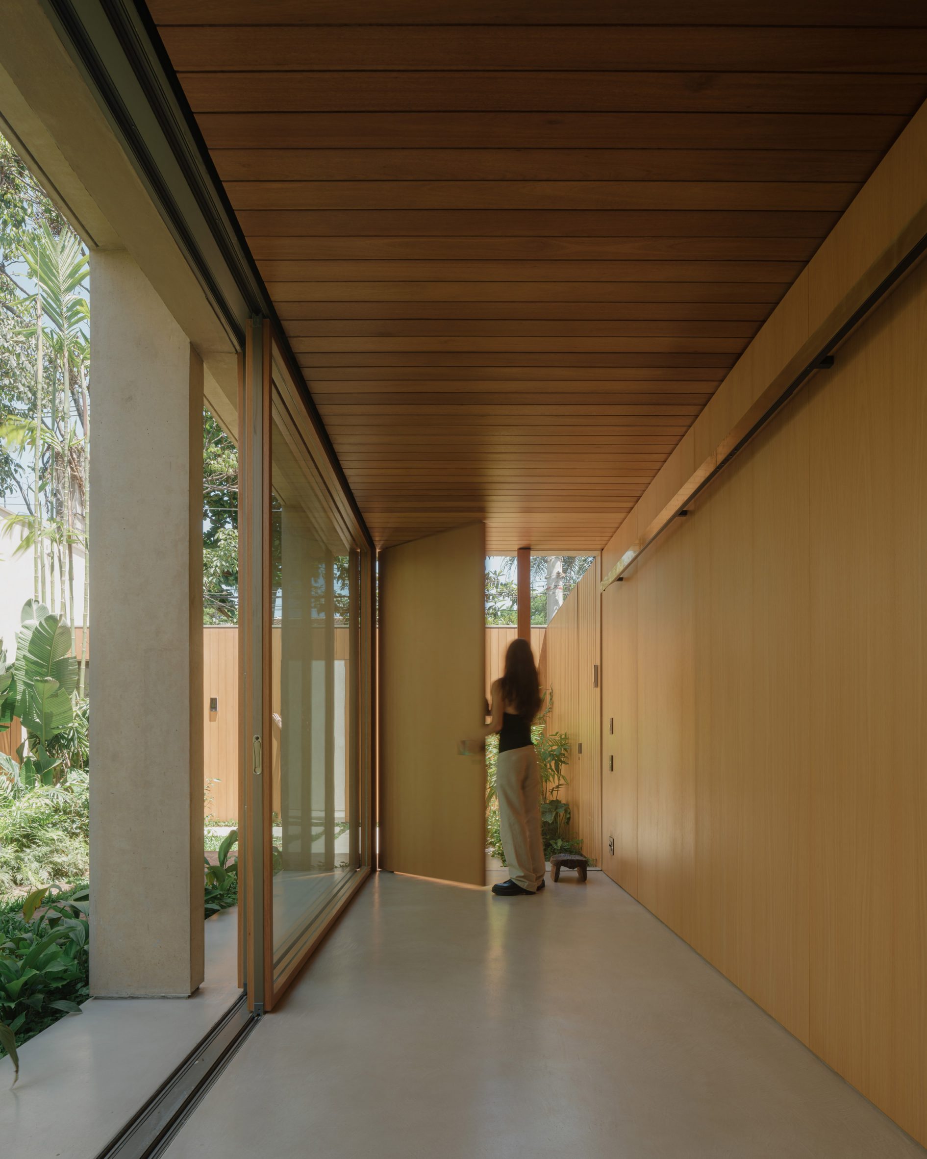Clara Rua raw concrete and muted tones anchor open-plan interiors at rua polônia ...